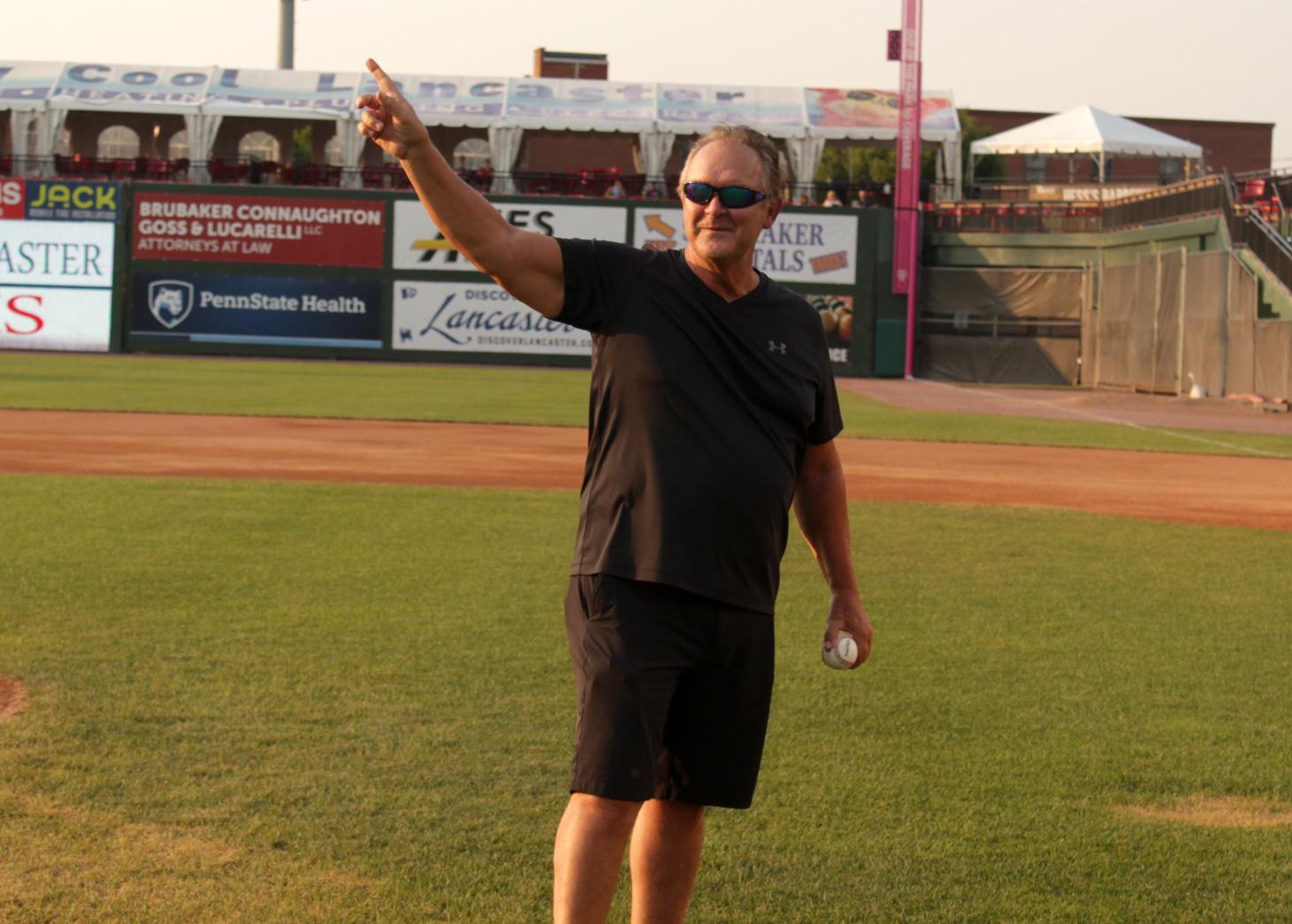 Tom Herr waves to crowd